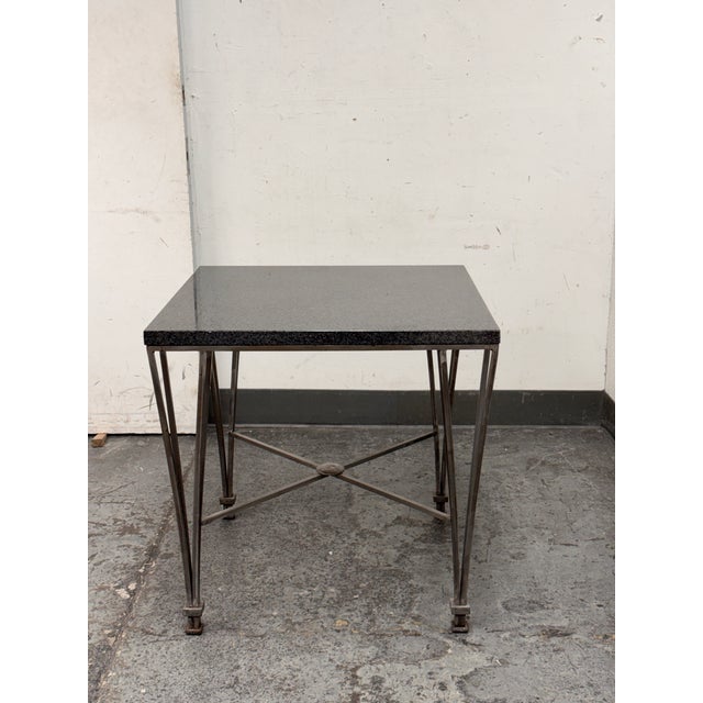 Design Plus Gallery presents a Post Modern Granite-Top Occasional Table. The table has a steel metal base with tapered and...