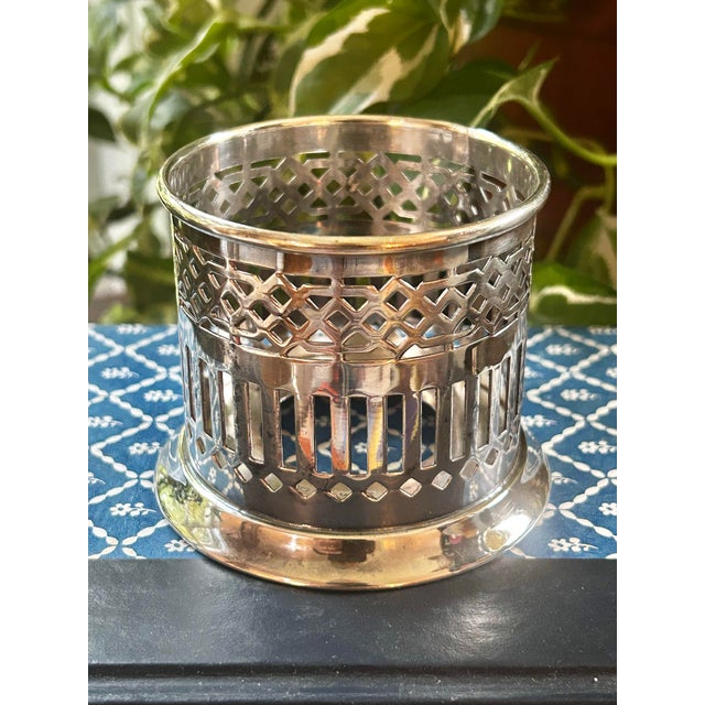 Add old world charm to your table setting with this silver plate condiment jar holder or sleeve. From Wilcox of...