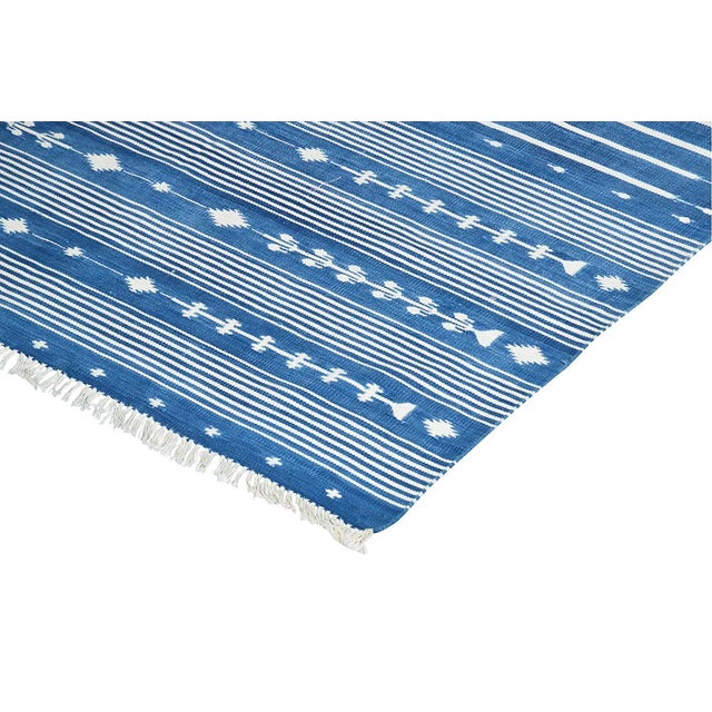 Presenting our Regal Dalia Collection! Made from naturally dyed 100% cotton yarn, these dhurrie rugs have been handwoven...