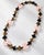 An authentic Hermès statement collar necklace showcasing the maison's iconic combination of natural horn and rich lacquer...