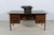 This desk by Arne Vodder was produced by Sibast in Denmark in the 1950s. This desk is made out of rosewood and is...