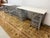 Design Plus Gallery presents a Pair of Elfa Classic Desks with Two Rolling Drawers from The Container Store. The white top...