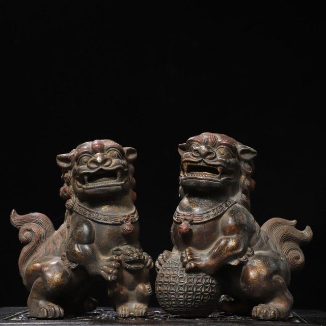 This is a handsome pair of vintage Chinese gilt bronze Foo Dogs, also known as Buddhist Guardian Lions (Shishi)....