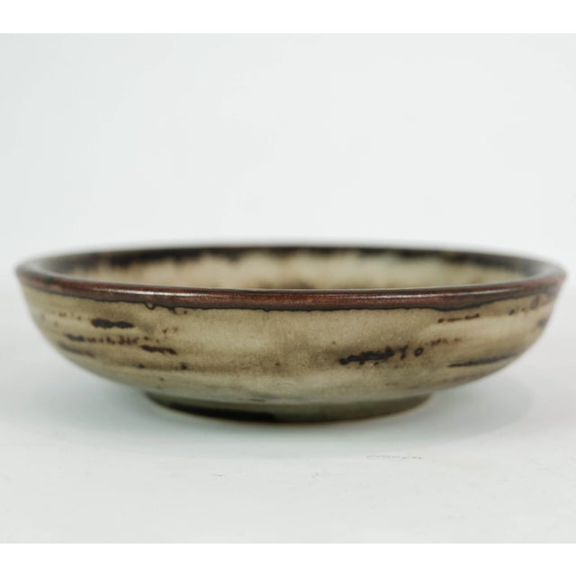 Stoneware bowl in brown colors, no.: 21567 by Gerd Bøgelund for Royal Copenhagen. The bowl is in great vintage condition....