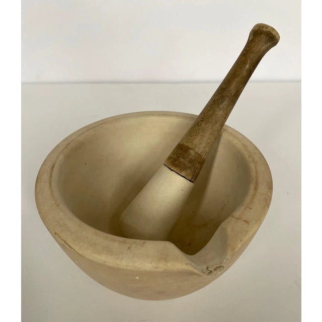 Antique mortar and pestle made by Thomas Maddock & Sons (3). Marked on the bottom T.M.S. Co Acid Proof. The company was...
