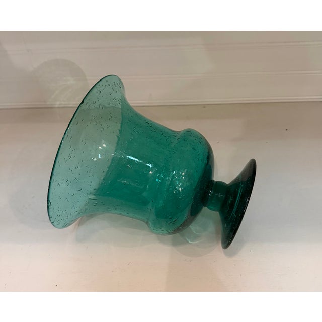 A lovely hand blown Blenko Teal Vase. The wonderful unusual teal color is a great collectors item and beautiful display...