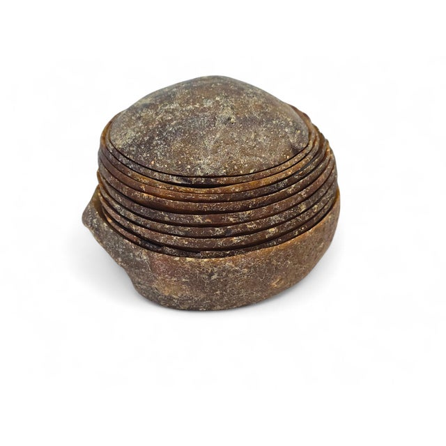 Exceptional set of nine agate bowls, masterfully carved from a single large agate formation during the 1970s. This...