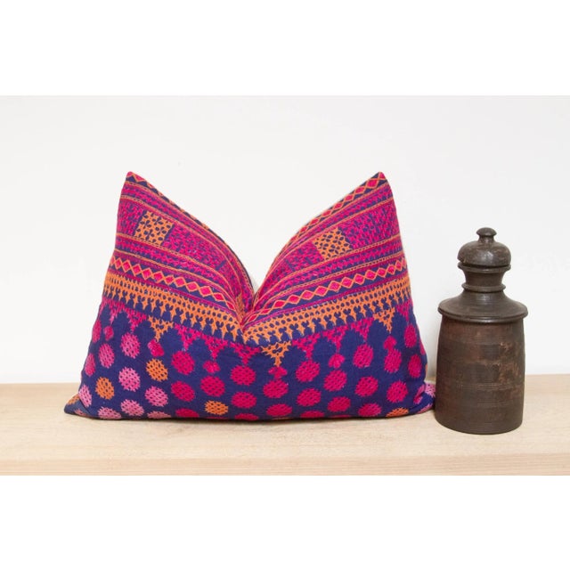 A lovely hand-embroidered pillow made from vibrant vintage tribal skirts coupled with a new linen back. This intricate...