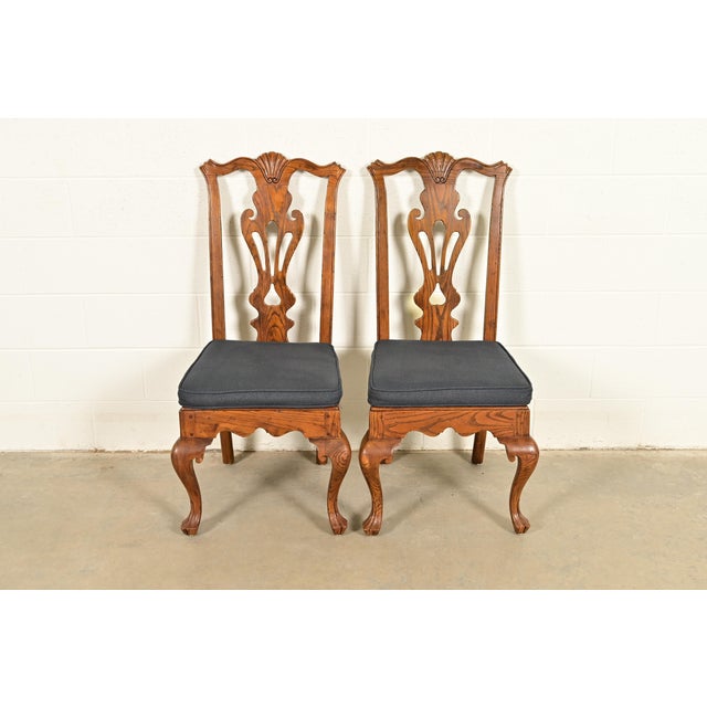 An outstanding pair of Chippendale or Georgian style side chairs or dining chairs By Henredon USA, Circa 1980s Carved...