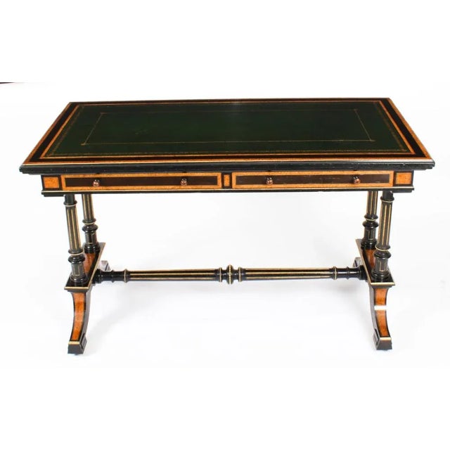 This is an elegant antique aesthetic period burr maple and ebonized writing table, stamped 'EDWARDS & ROBERTS' Circa 1870...