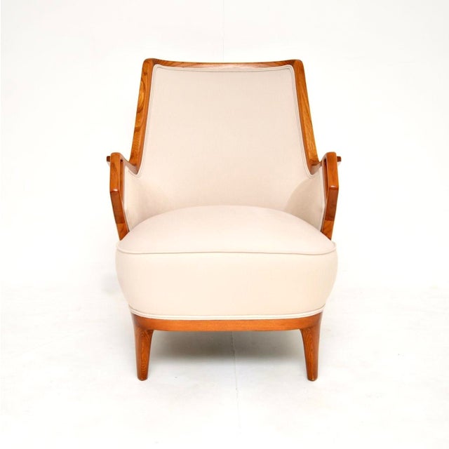 An outstanding vintage Swedish Elm armchair with a very stylish and unusual design. This was recently imported from...