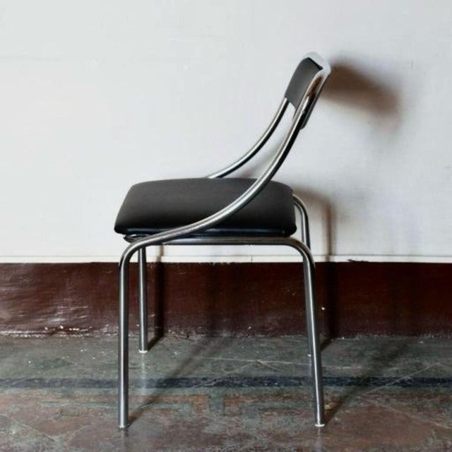 Set of Four Vintage Chromed Dining Chairs, Faux Leather, Italy, 1970 Four vintage dining chairs with a refined industrial...