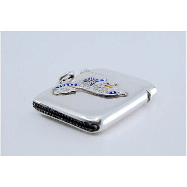 Embossed Silver Matchbox with Hinged Lid and Hanging Ring, in Very Good conditions. Designed 1890 to 1919 This piece has...