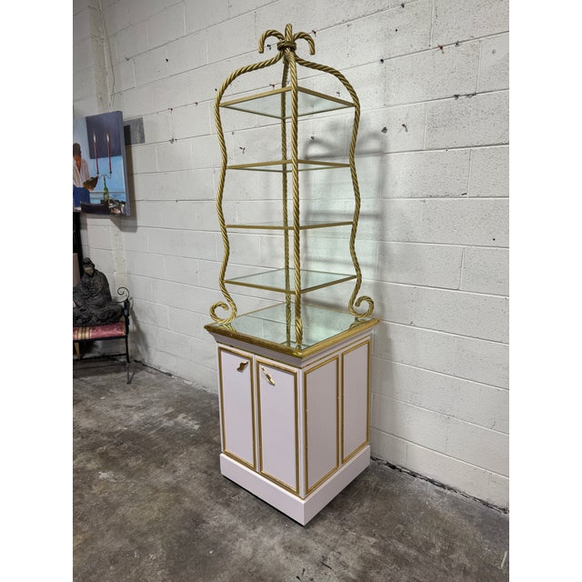 I think this was a display piece in an old Victoria Secret store, but not sure. Its really cool! Glass shelves, twisted...