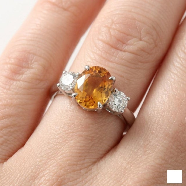 Professional Product Description: This stunning ring showcases a vibrant Citrine gemstone at its center, admired for its...