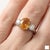 Professional Product Description: This stunning ring showcases a vibrant Citrine gemstone at its center, admired for its...
