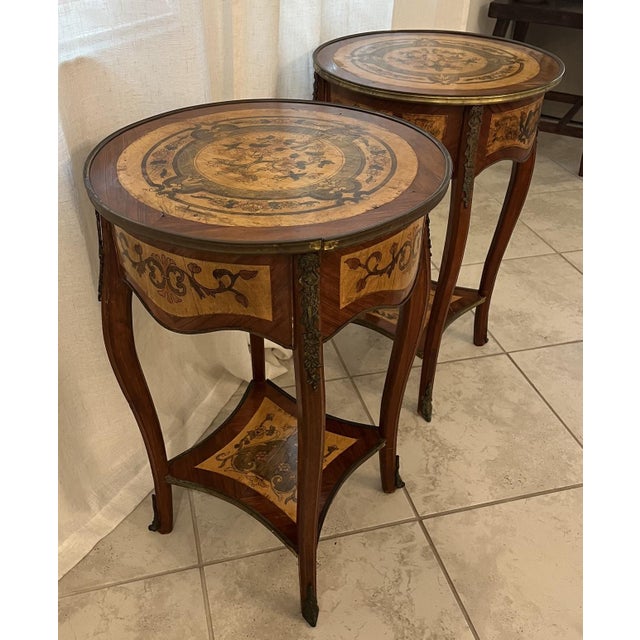 These are a pair of beautiful Mid-Century wood French Louis XV Style Marquetry Side Tables. Featuring intricate floral and...