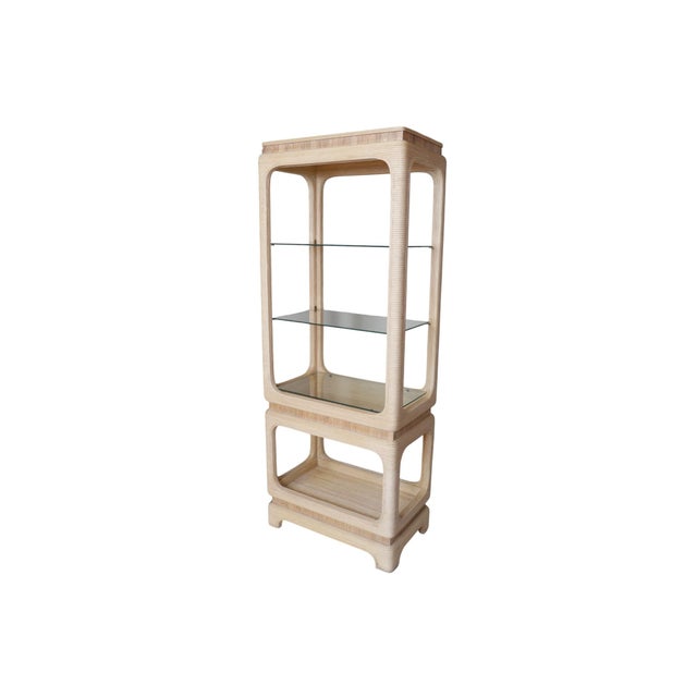 A pencil wood bamboo and glass etagere in the manner of Gabriella Crespi. A hardwood frame wrapped in pencil wood bamboo...