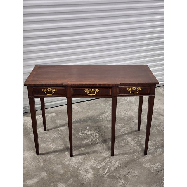 Antique late 19th century Sheraton satinwood Mahagony inlay console table with projecting center frieze drawer. Featuring...