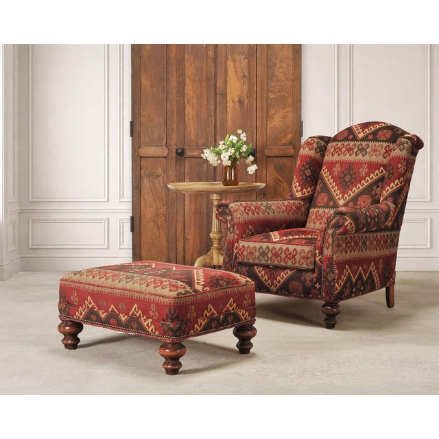 A handsome wingback lounge chair and matching ottoman made by Old Hickory Tannery in Hickory, North Carolina, for the King...