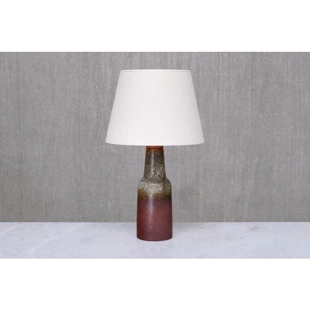 This rare table lamp was designed by sven wejsfelt and produced by gustavsberg studio in sweden in the 1960s. The lamp is...