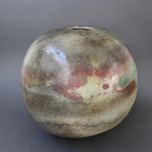 Large spherical stoneware vase by ingeborg and bruno asshoff (circa 1960s). A multi-hued overflow glaze with mulberry and...