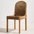 Rattan chair from the 1970s with natural details. The legs of the chair are made of oak, while the seat and backrest are...