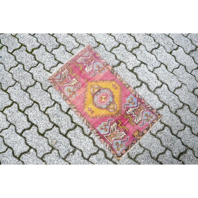 This is a vintage Turkish Oushak rug from the 1960s. The piece was hand-knotted.