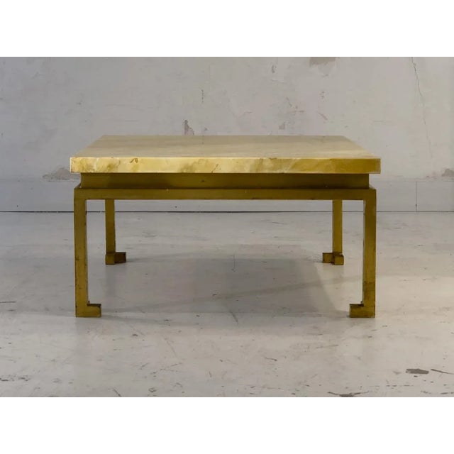 An elegant square coffee table, Post-Modernist, Shabby-Chic, Chinese-inspired cubic base in patinated square section...