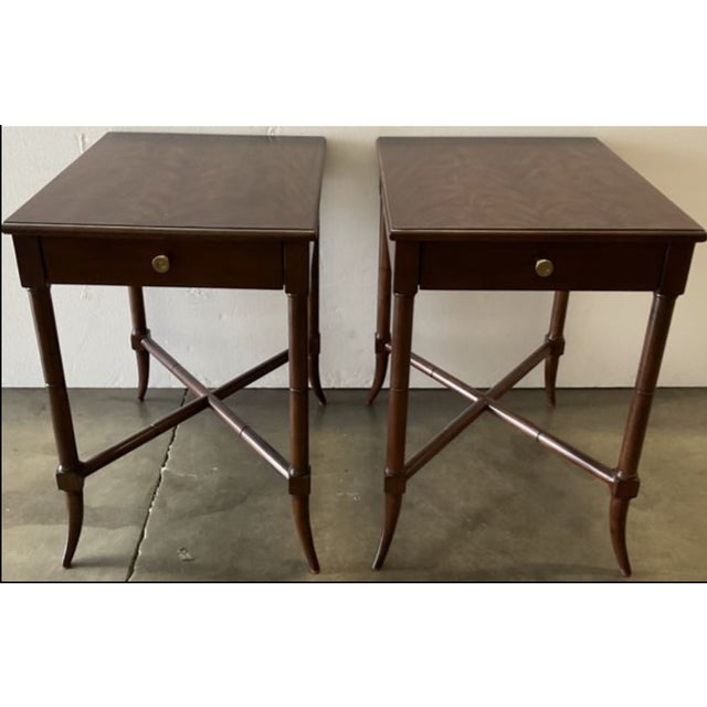 This Woodbridge “Clarkson” lamp table, elegantly finished in Montserrat with brass accents, is a refined take on 19th-...