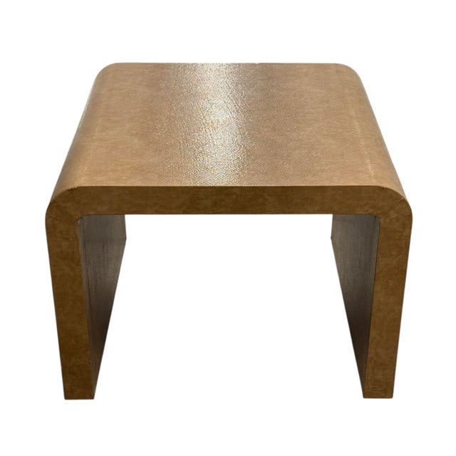 This large waterfall side table can be used for many spaces and decors. It is a dark camel colored tan and has subtle...