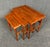 Here is a lovely set of three nesting tables in teak manufactured in Denmark in the 1960's. This set, recently refinished...