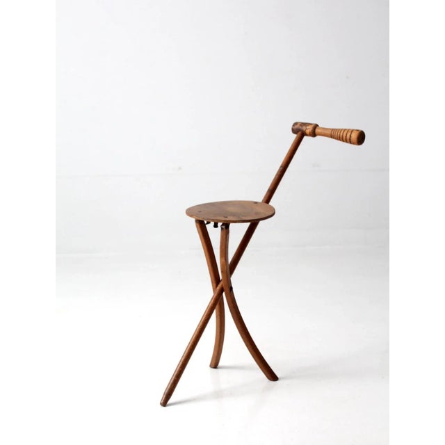 This is a Stafford-Johnson Kan-O-Seat walking cane stool circa 1930s-1940s. The clever design allows for the walking stick...