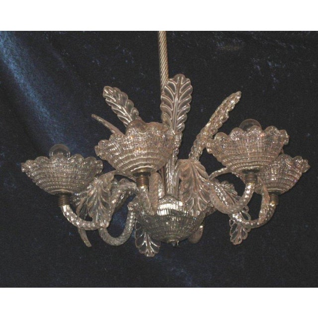 Antique Murano glass chandelier, transparent, rostrate in the style of Ercole Barovier. Circa 1940, made in Italy in...