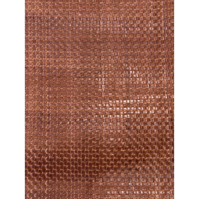 Thin strips of quality upholstery leather are woven by hand to create a distinct texture which adds a sense of luxury and...