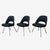 A trio of Knoll Executive armless chairs designed by Eero Saarinen for Knoll. The chairs are upholstered in Knoll Textiles...