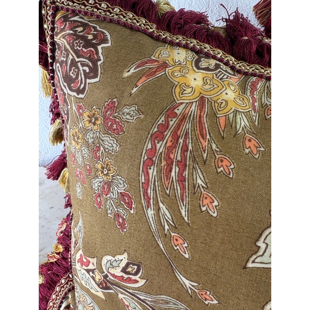This is a pair of floral cotton print pillows with a tasseled Lee Jaffa fabric. This pair of lumbar pillows have a...