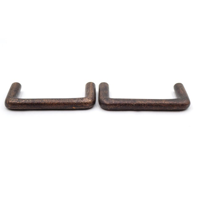 Modern style solid brass bridge drawer pulls with a darkened patina. Mounting screws are included. Good condition with...