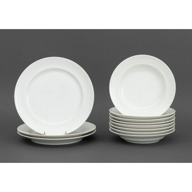 Royal Copenhagen Porcelain Partial Dinnerware Service, comprising: (3) three dinner plates, (8) eight soup bowls, (7)...