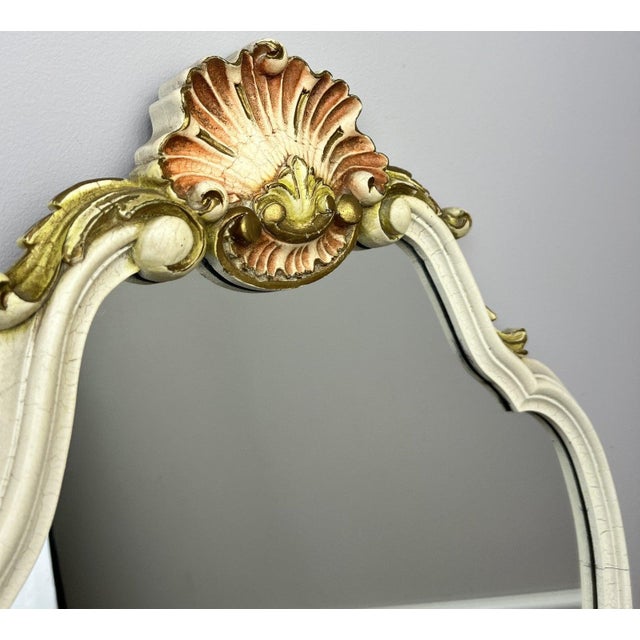 A beautiful Vintage shabby chic wall mirror featuring an elegant shaped frame with ornate shell detailing and decorative...