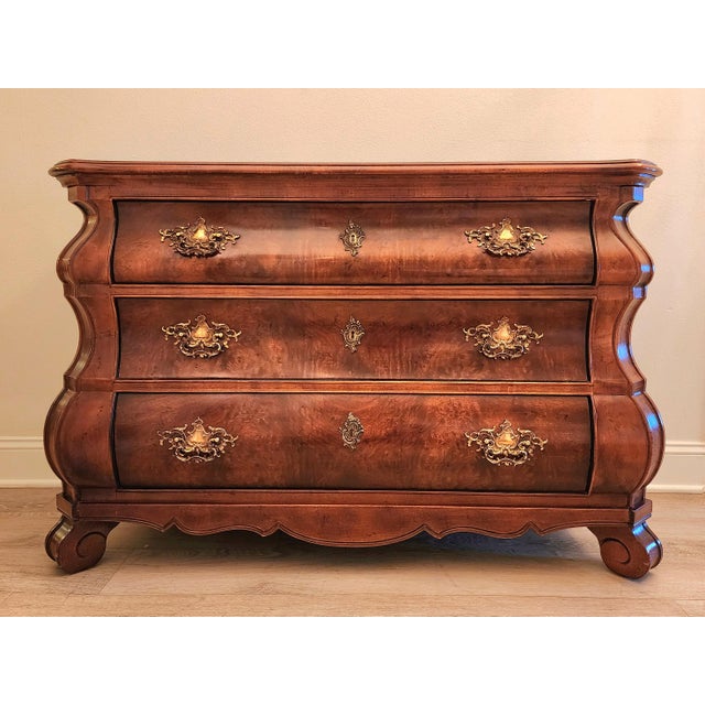 A classic Henredon, French Provincial, Louis XV Style Bombe chest. Stained in a warm, rich finish. Sturdy, dovetail joints...