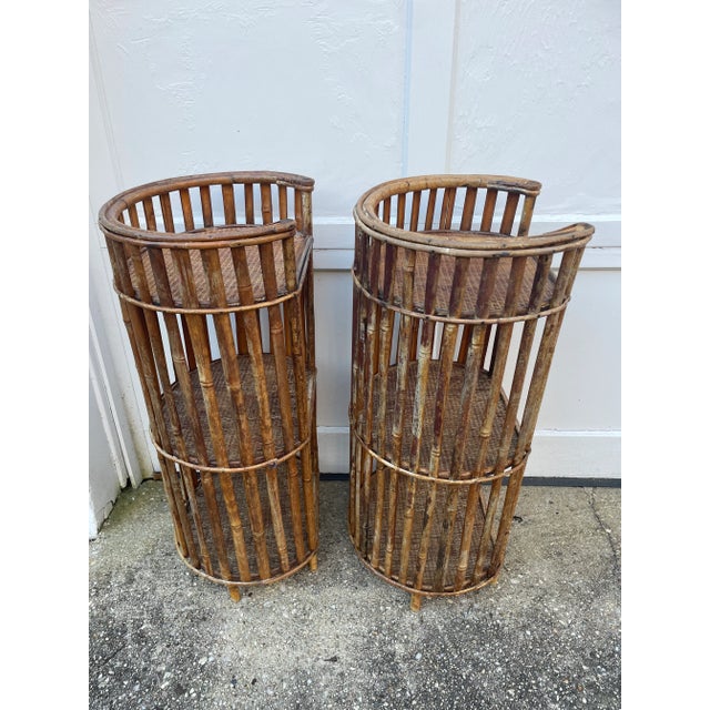 This pair of side tables are unique and beautiful. They are each three tiers of woven rattan ropes with bamboo shafts...