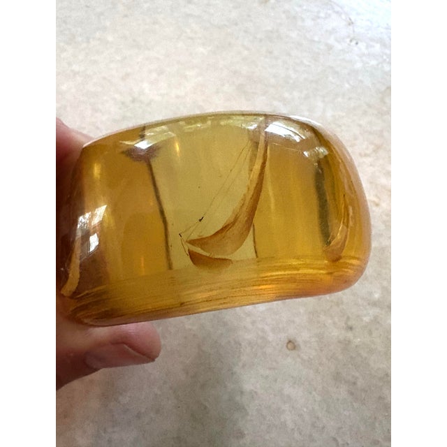Rare Art Deco Reverse Carved Apple Juice Bakelite Cuff With Ship Etching design.