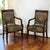 A refined pair of early 19th century French Empire period armchairs, handcrafted in mahogany with the disciplined...