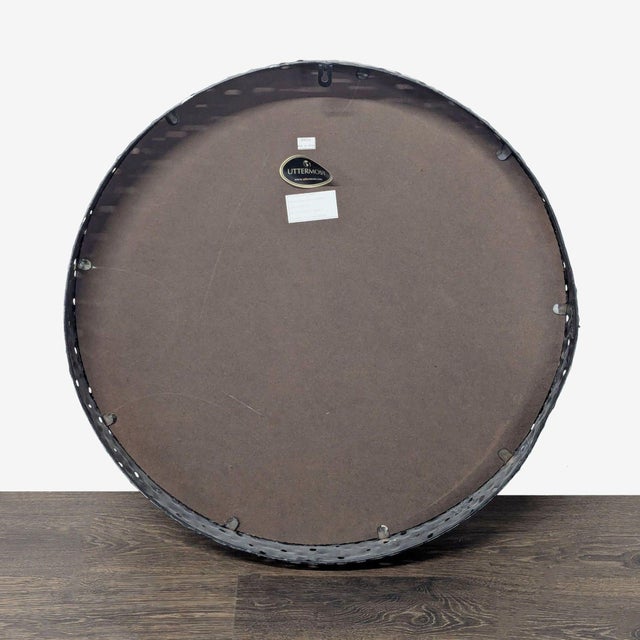 This frame has a deep side profile constructed from pierced hammered metal finished in a burnished gray wash with silver...