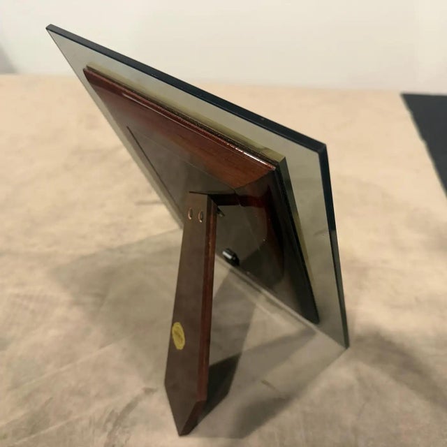 This sophisticated Italian picture frame is a prime example of 1970s luxury design, blending the structural elegance of...