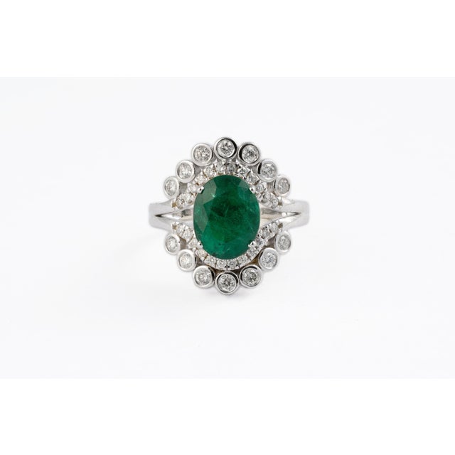 This is an amazing everyday wear ring with high quality Zambian natural emerald and very good clarity diamonds which are...