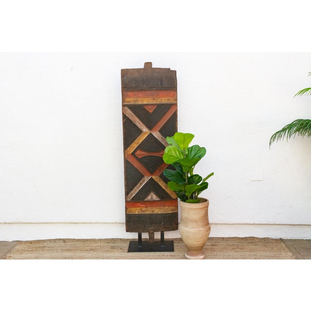This carved and painted door belongs to the graphic tradition shared by the Bwa and Gurunsi peoples of Burkina Faso — Gur-...