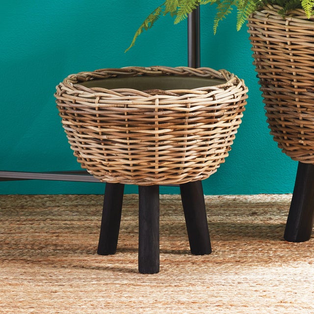 Here, s a smart idea a thick rattan planter tightly woven around grower, s pots. The plastic pot helps the weave retain...