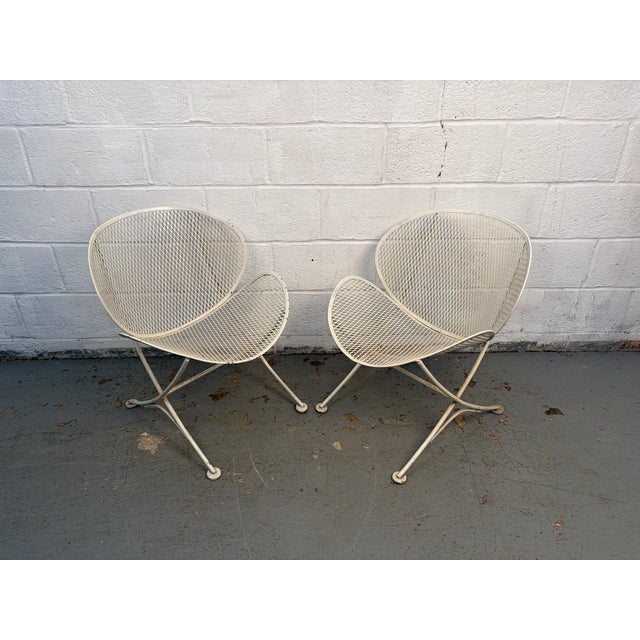 Iconic pair of mid-century modern Italian outdoor chairs designed by Tempestini and manufactured by Salterini. Featuring...